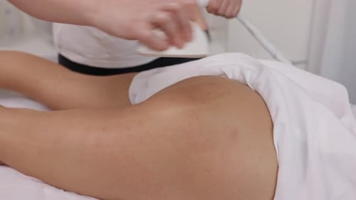 Woman Receiving Body Sculpting Massage at Clinic