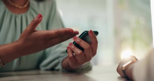 Woman Holding Cell Phone Ready to Hand it Over