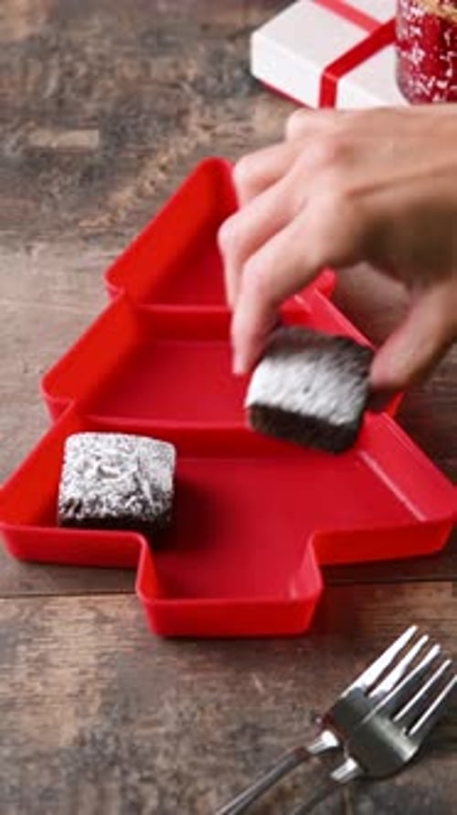 Brownies with Powdered Sugar in Christmas Tree Tray