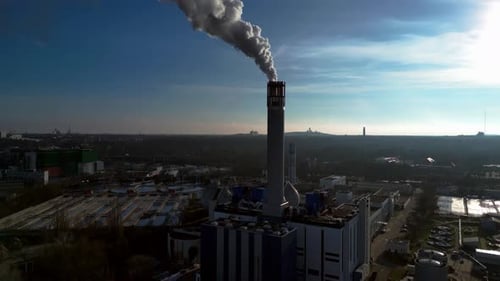 Waste energy plant factory with smoke chimney. Majestic aerial view flight drone