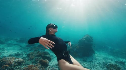 Woman Freediver on Reef Young Female Freediver Swims Underwater and Explores the Healthy Coral Reef