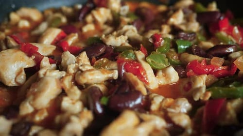 Close up of appetizing and bubbling colorful ingredients for homemade fajitas