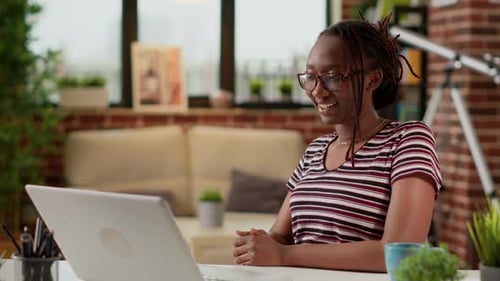 Young Woman Having Video Conference at Home Office