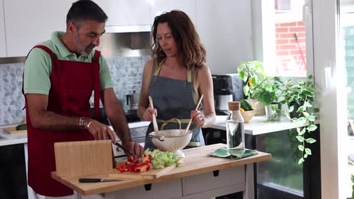 Couple Cooking Together in Bright Kitchen