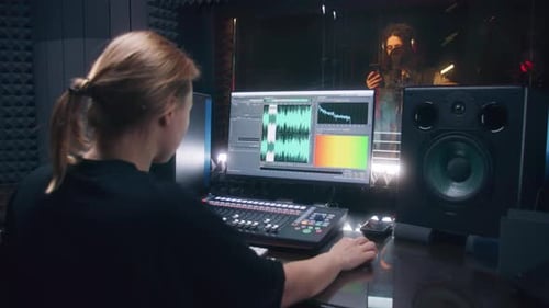Female Audio Engineer Records Song for Male Singer