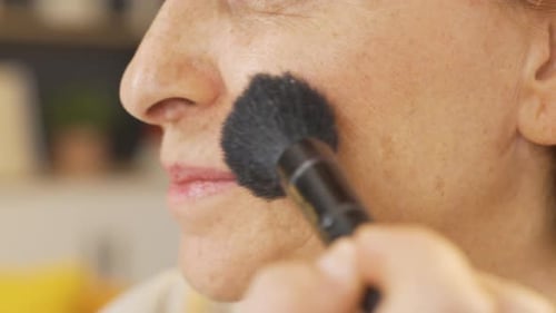 Applying make-up close-up.