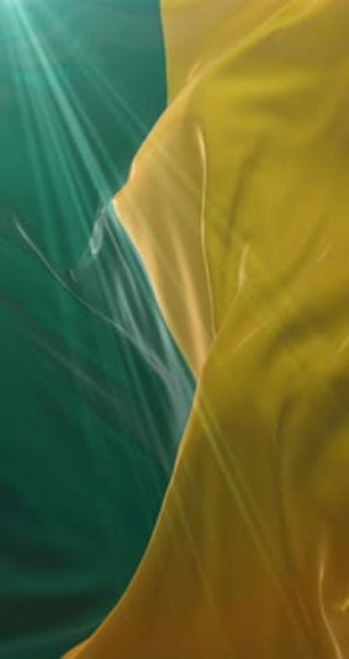 Fluid Yellow Fabric Swirl with Teal Light Rays Background