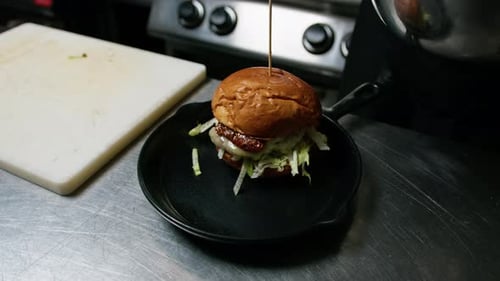 Burger Being Prepared With French Fries