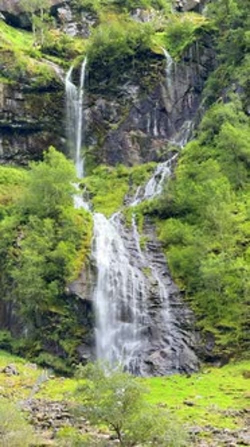 Scenic Mountain Waterfall Cascading Down Rocky Cliffs