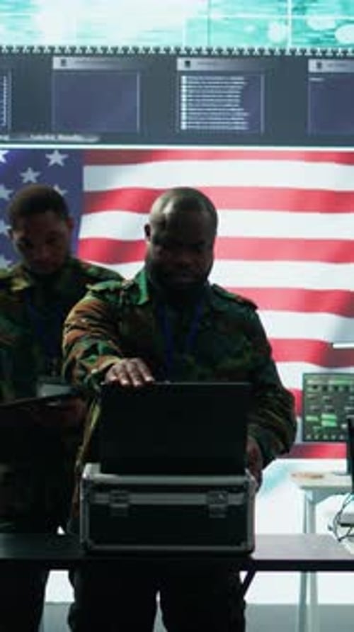 Vertical Video Military Officer in a High Tech Control Center Engages in Cybersecurity Operations