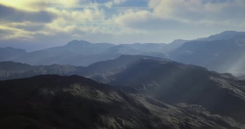 Majestic Mountain Landscape Under a Softly Illuminated Sky at Twilight
