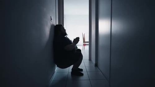 One man depressed person feeling despair in corridor suffering from mental illness alone