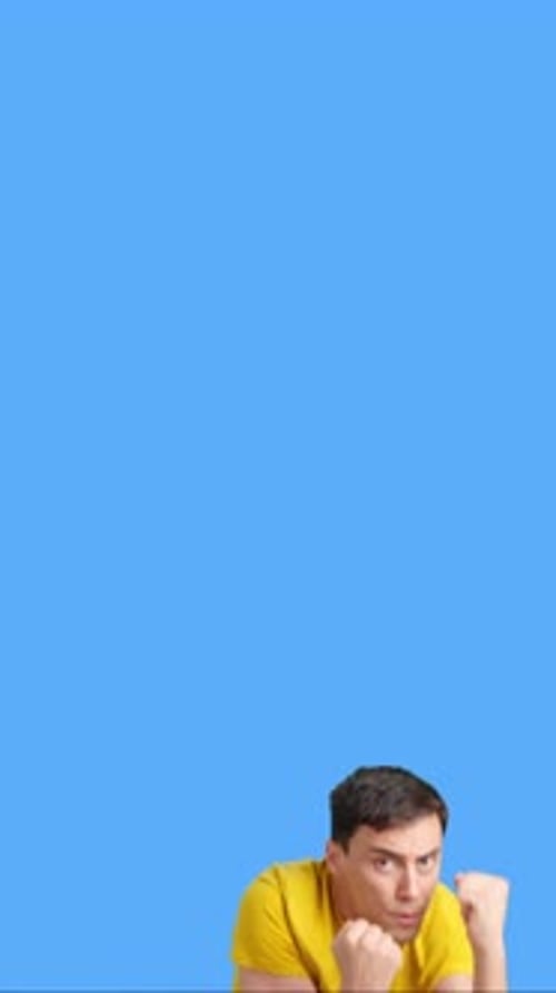 Adult Fights in Boxing Stance on Blue Background