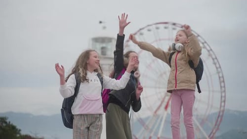 School Friends are Jumping Up and Down and Rejoicing at the Start of the