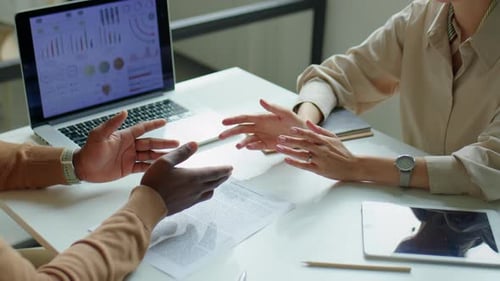 Business Professionals Agreeing and Shaking Hands in Office