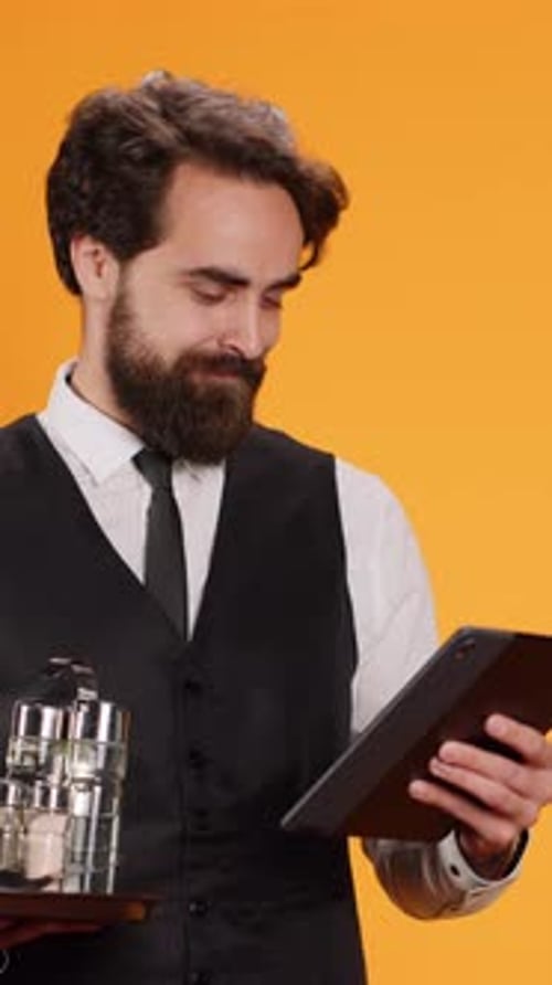 Vertical Video Staff Member Prepares Check on Tablet