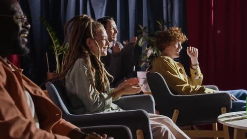Audience Laughing and Applauding While Watching Stand-Up Performance