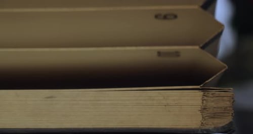 Opening an old empty filing book. Close-up