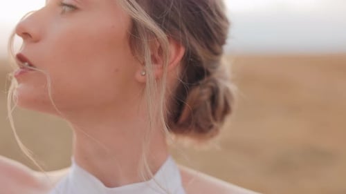 Blonde Woman Posing in Rural Field
