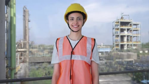 Happy Indian female construction worker