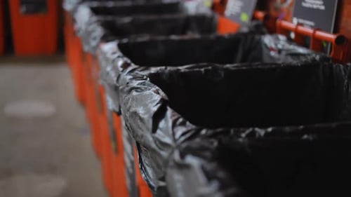 Live Camera Moves Forward Along Row of Garbage Bins for Waste Separation No People on Recycling