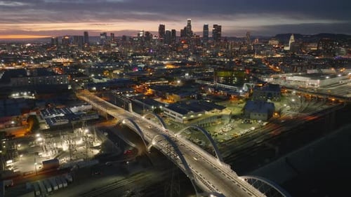 Aerial Footage of Evening Cityscape Backwards Reveal of Illuminated 6Th Street Viaduct Los Angeles
