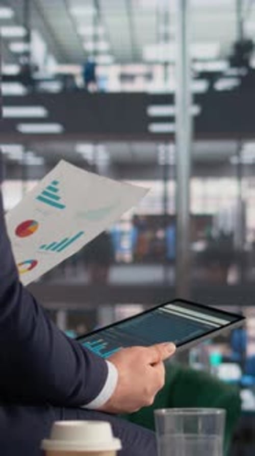 Vertical Video Business Professional Analyzing Insights and Metrics for Company Productivity