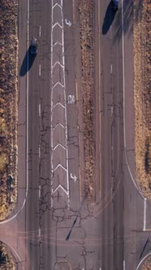 Vertical Drone Shot, Traffic on American Desert Road, State Route With Vehicles and Cracked Asphalt,