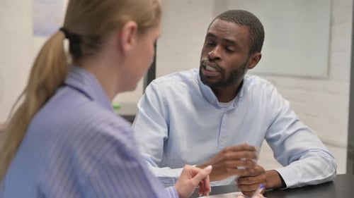 Discussing Creative African Man During Meeting, Close up