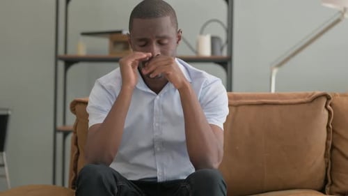 Stressed Man Sitting on Couch