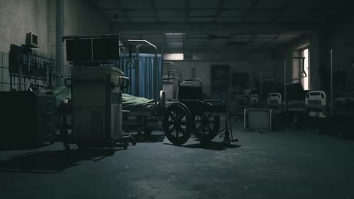 Abandoned Hospital Ward with Empty Beds and a Solitary Wheelchair at Dusk