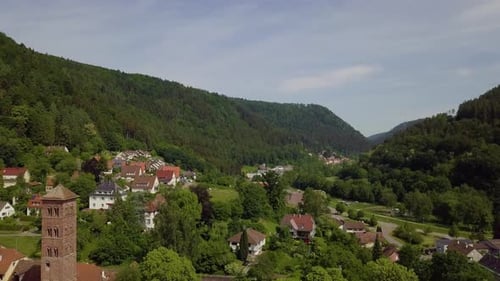 Aerial footage of the mountains and historic buildings in a mountain village, 4k