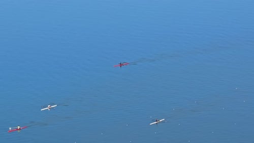 Rowing Boat racing in Competition along Coast with Aerial Drone.