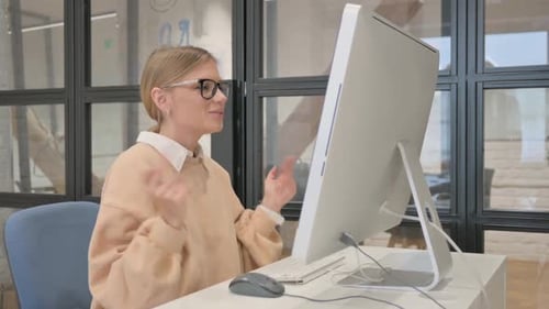 Woman Participates in Video Call in Office