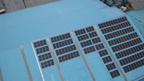 Aerial view of solar cell panels installed on roof of the factory