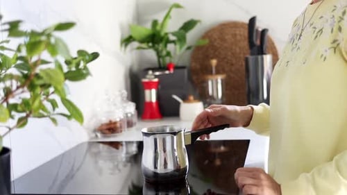 Woman Making Coffee in Modern Kitchen