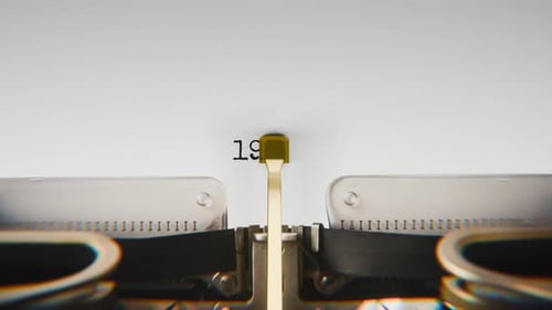 Old mechanical typewriter typing Year 1997 in a close-up view.