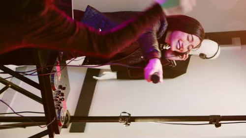 Vertical Video Young Adult Partying on Stage at Club
