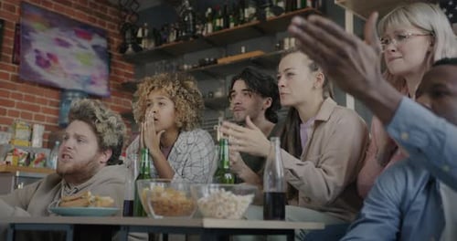 Friends and Family Watching Sporting Event Together