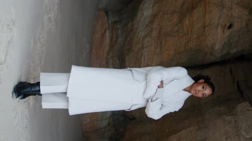 Stylish Woman Posing on a Sandy Beach