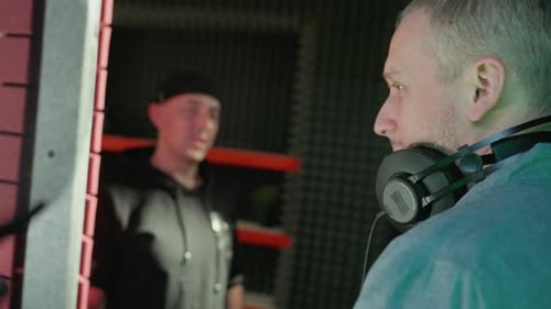 Studio Discussion Between Two Professionals