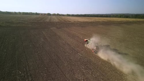 Tractor on the field seeding wheat
