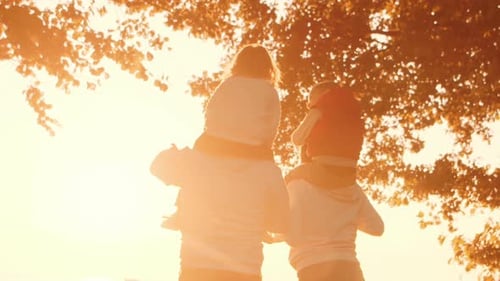 Family Walks in the Countryside During Sunset Love Parental Care and Children Concept