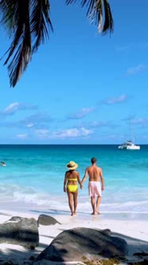 Couple of Men and Women on the Beach of Anse Lazio Beach Praslin Island Seychelles