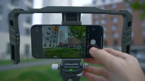 Smartphone on Tripod Films Cityscape