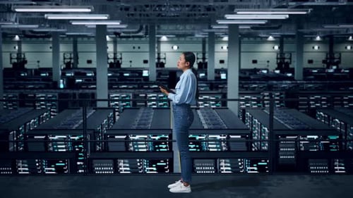 Side View Of Full Body Asian Business Woman Using Tablet An Looking Around In Data Center