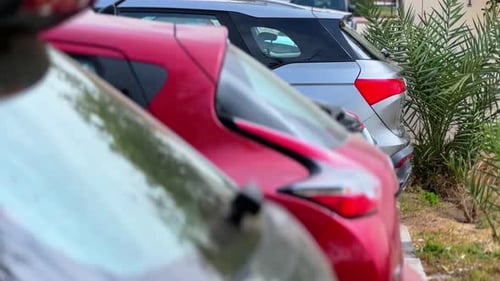 Modern Cars Parked in Row – Urban Street Parking Scene in 4K.