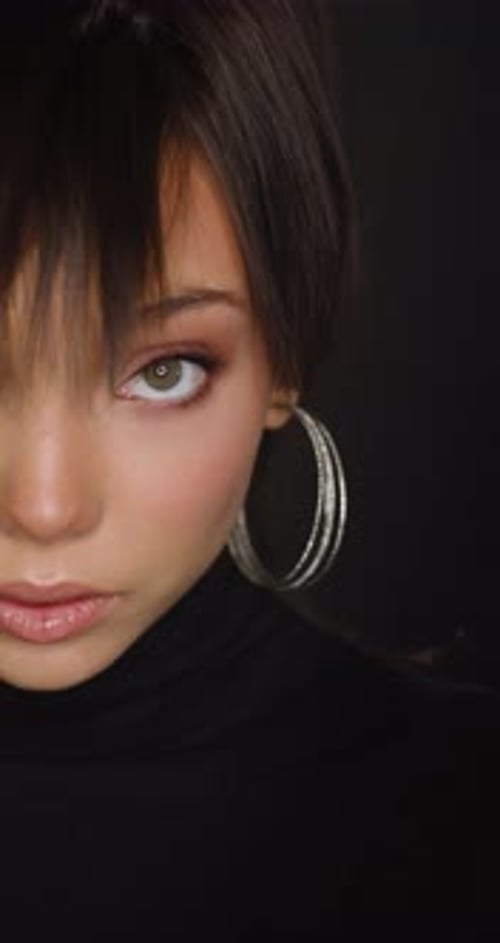 Beautiful Woman Smiling with Hoop Earrings Close Up