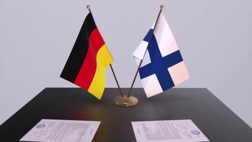 Germany and Finland Flags on a Table