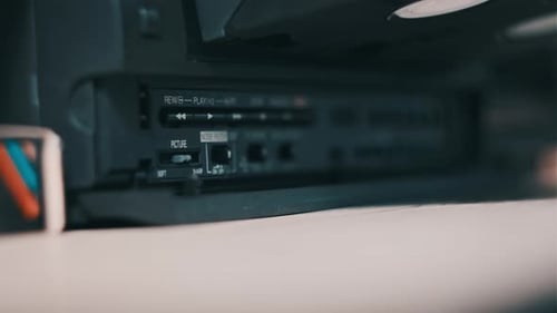 Insert VHS Cassette Into VCR Video Player